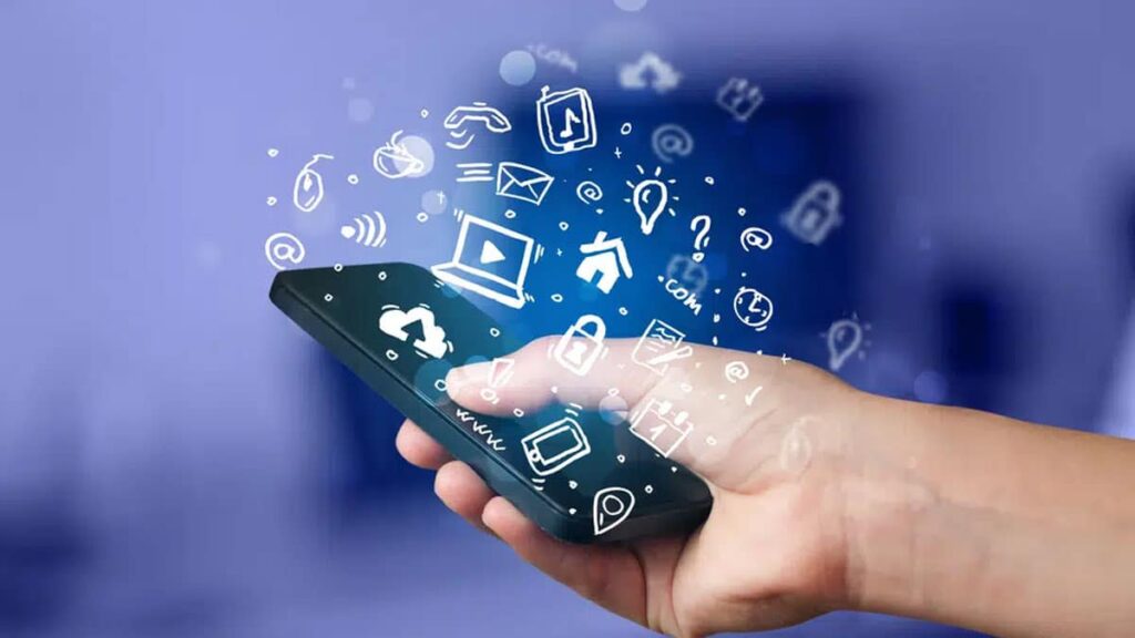 Photo of a person using a phone with icons of a computer, email, lighbulb and more