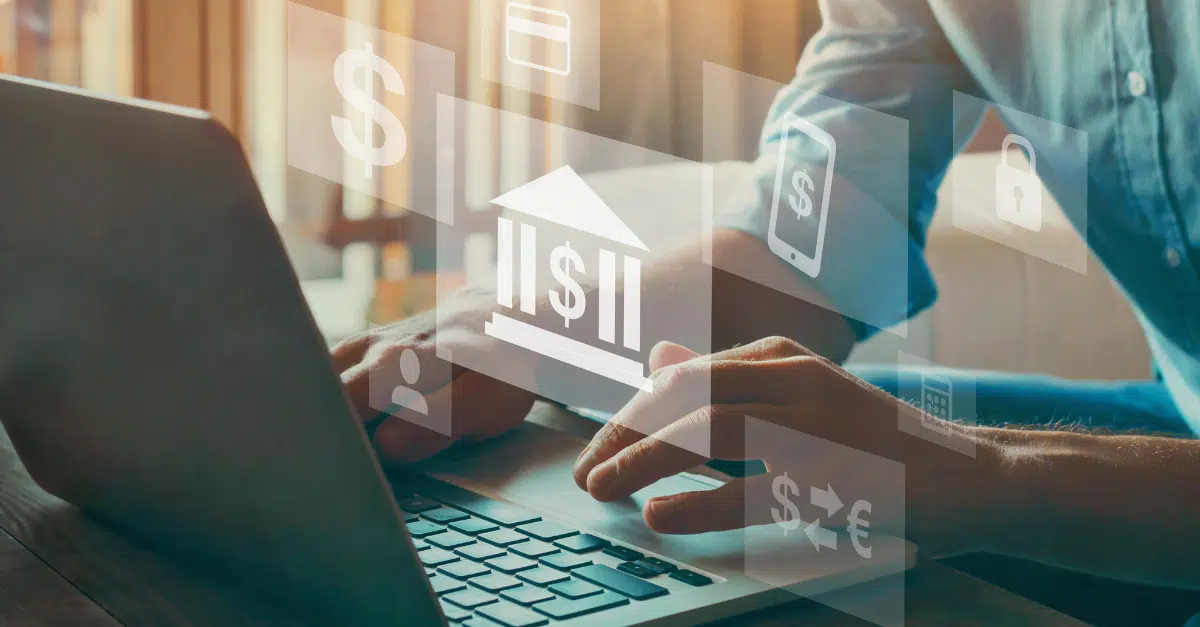 A person typing on a laptop with digital financial icons, including a bank symbol, dollar signs, and security locks, representing AI in fintech.